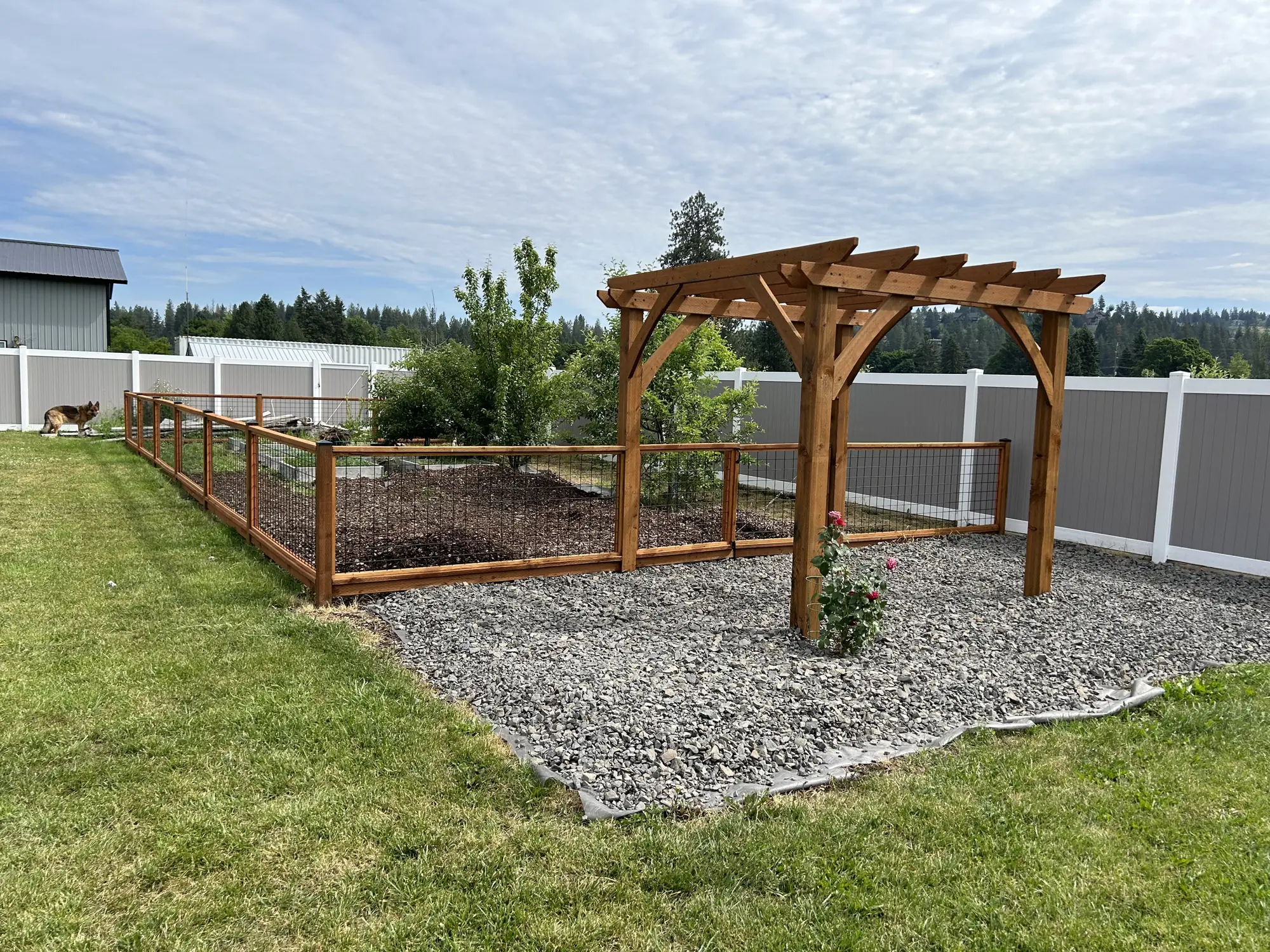 Timber-framed Garden Gate pergola built by Honey Rock Construction in North Idaho